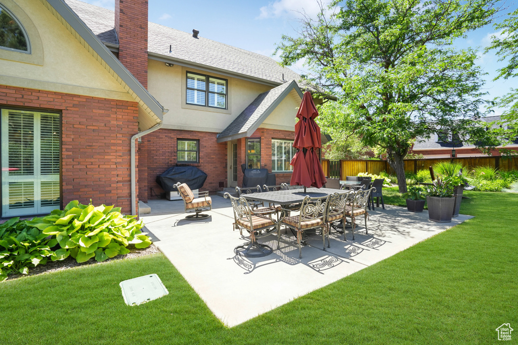 Exterior space featuring a yard and a patio