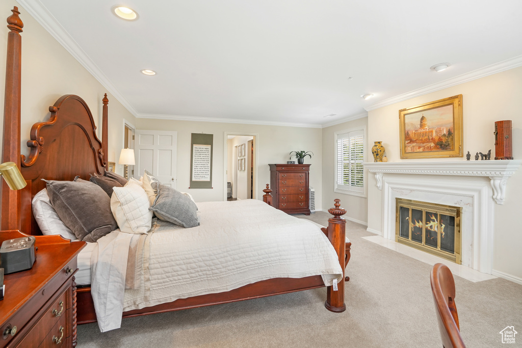 Bedroom featuring carpet flooring and ornamental molding