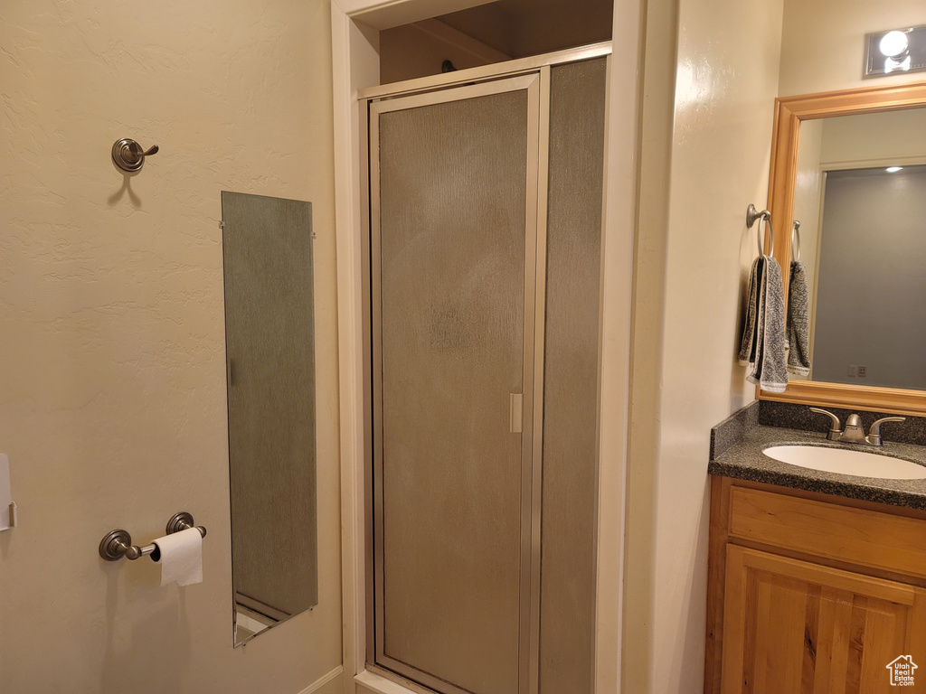 Bathroom with vanity and an enclosed shower