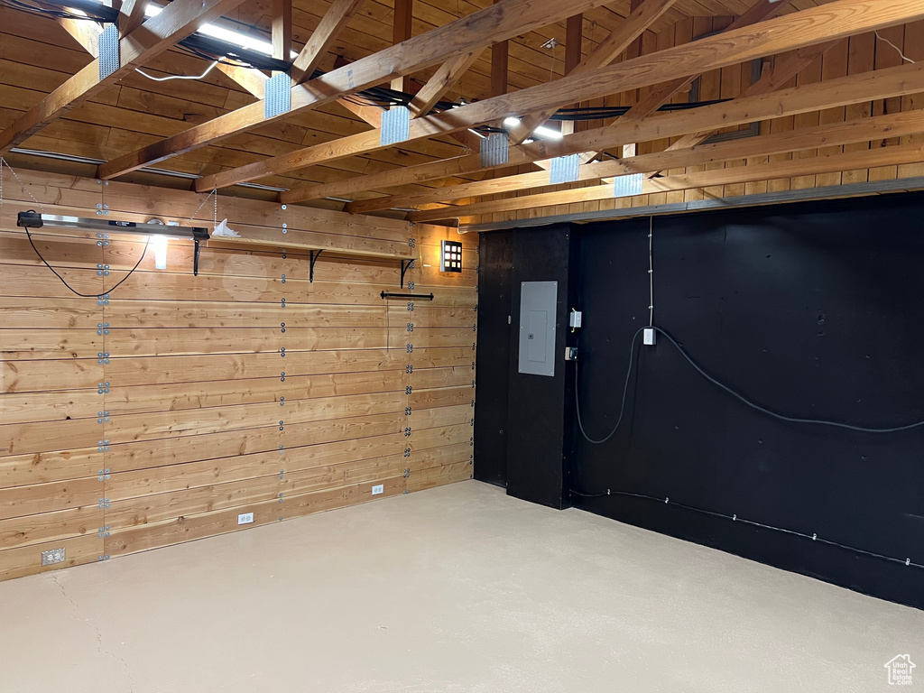 Basement with wooden walls and wood ceiling