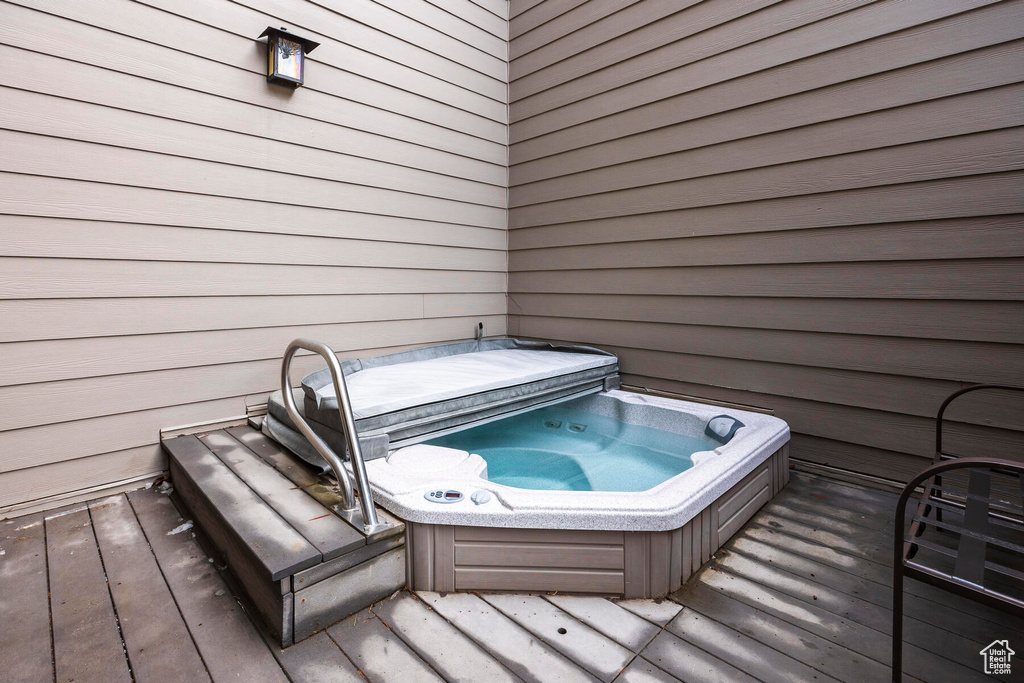 Exterior space with a covered hot tub