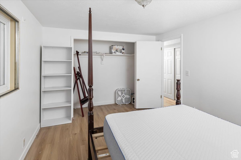 Bedroom featuring a closet and light hardwood / wood-style floors
