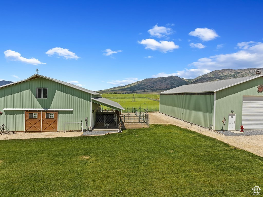 View of yard featuring an outdoor structure and a mountain view