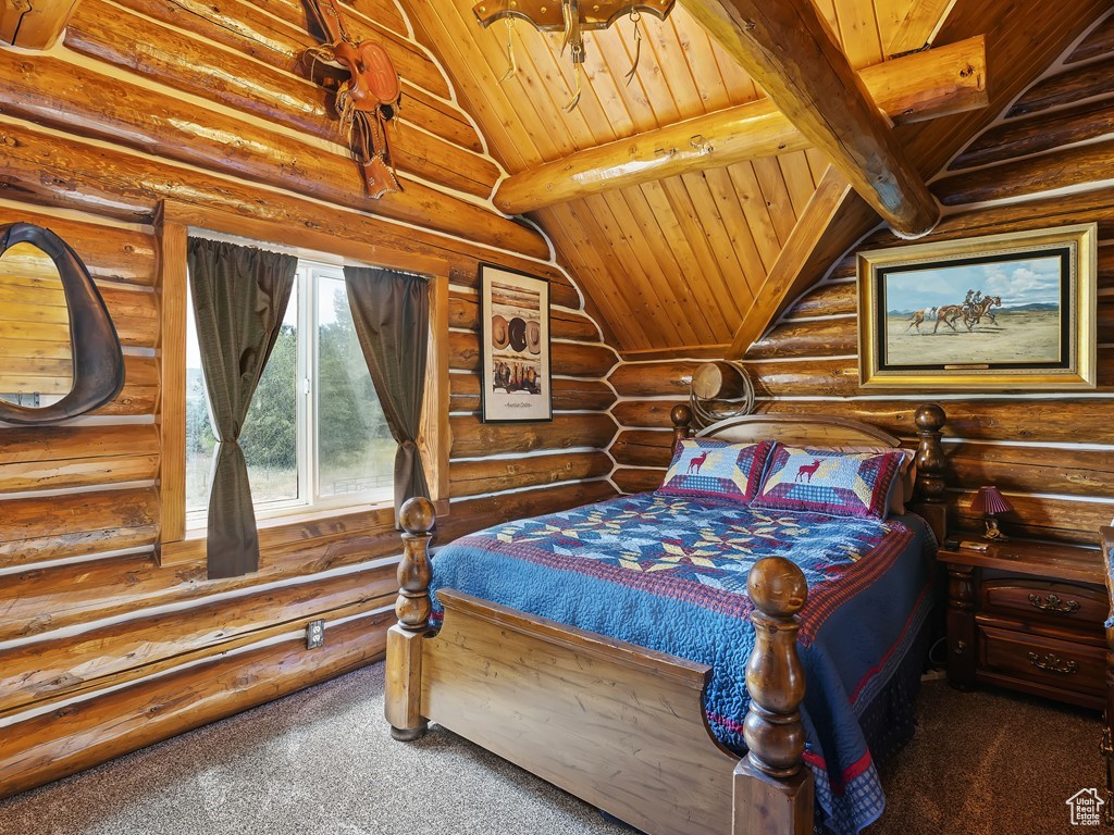 Carpeted bedroom featuring lofted ceiling with beams, log walls, and wood ceiling