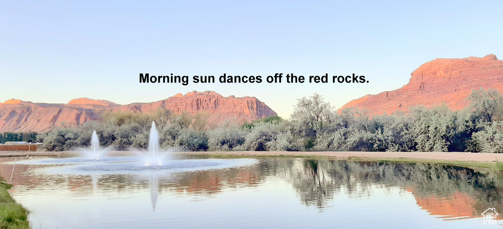 View of water feature with a mountain view