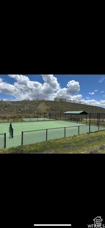View of sport court with a rural view