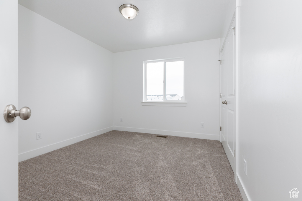 View of carpeted spare room