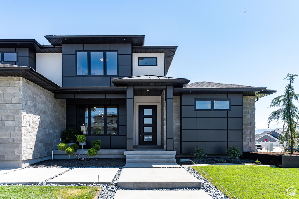 Modern home featuring a front yard