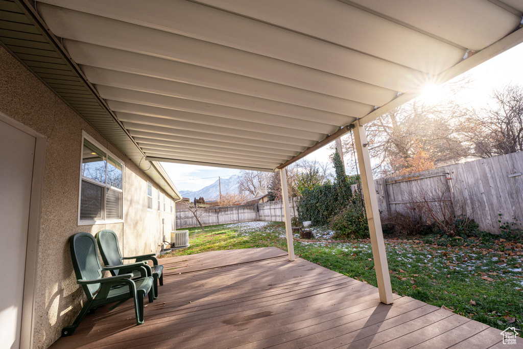 Wooden deck featuring a mountain view and central AC