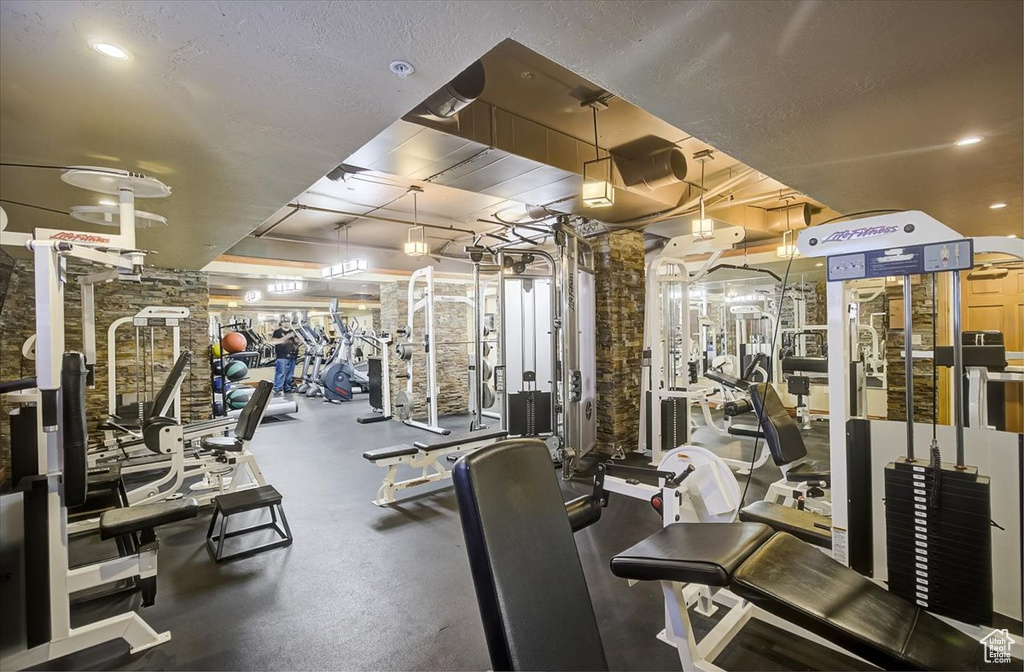 Workout area featuring a textured ceiling