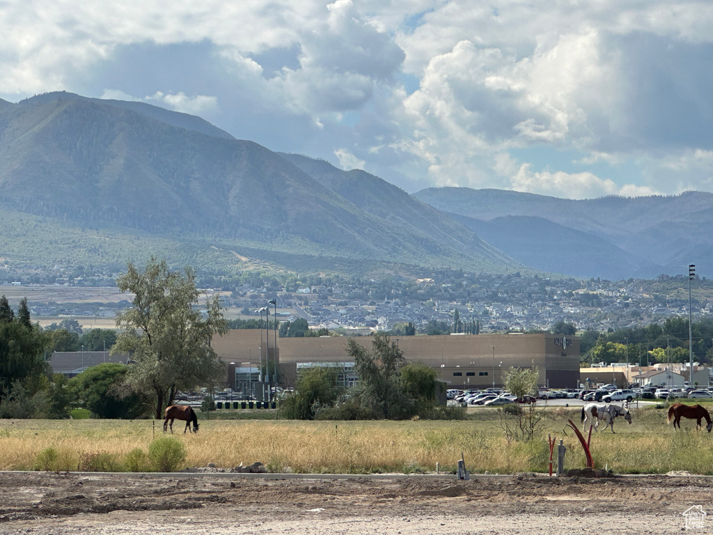 Property view of mountains with a rural view