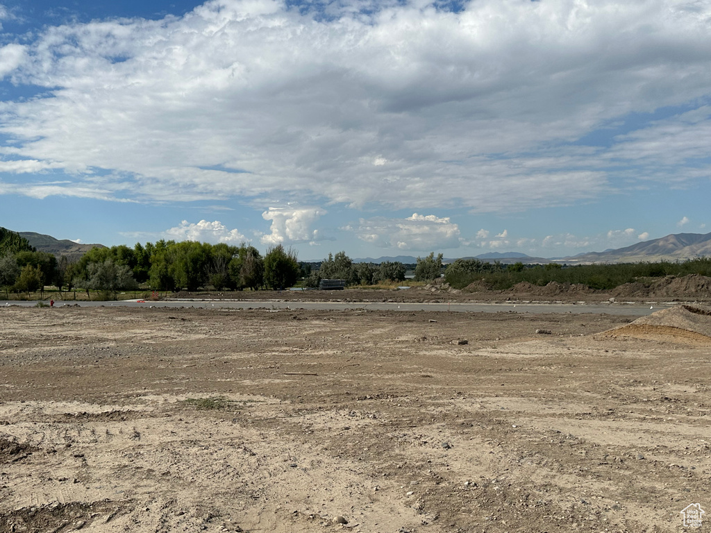 View of local wilderness featuring a rural view and a mountain view