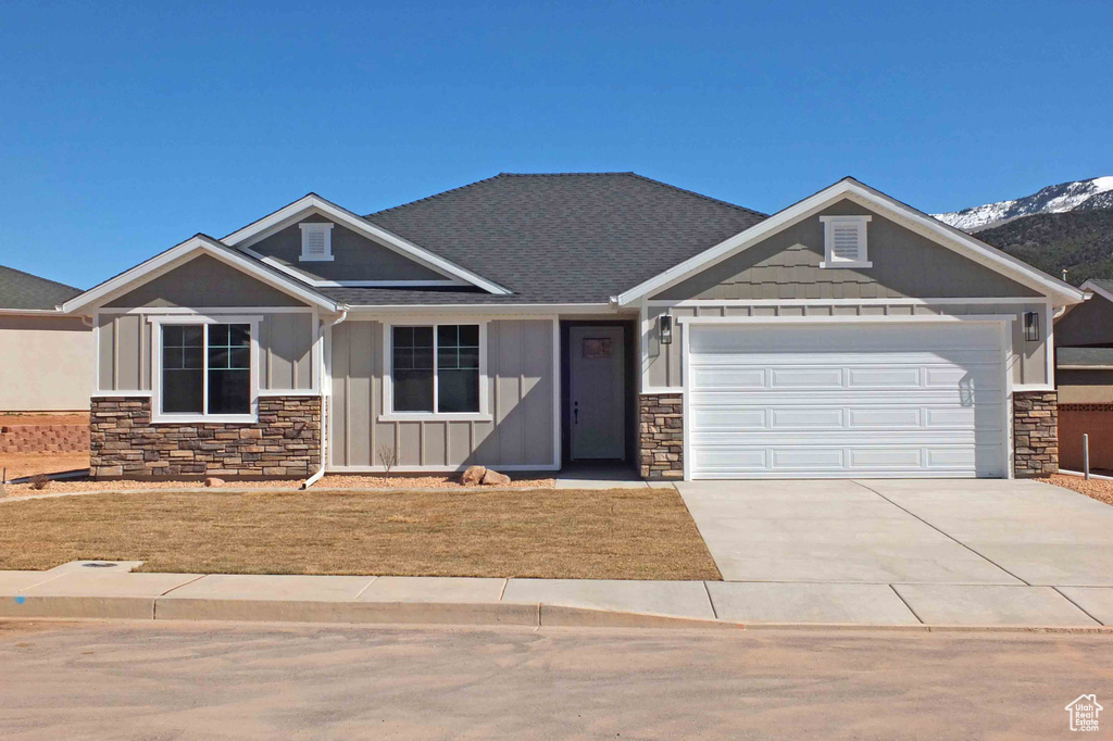 Craftsman house featuring a garage and a mountain view