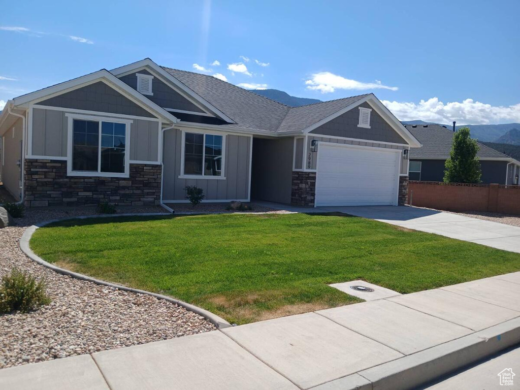 Craftsman house with a front yard