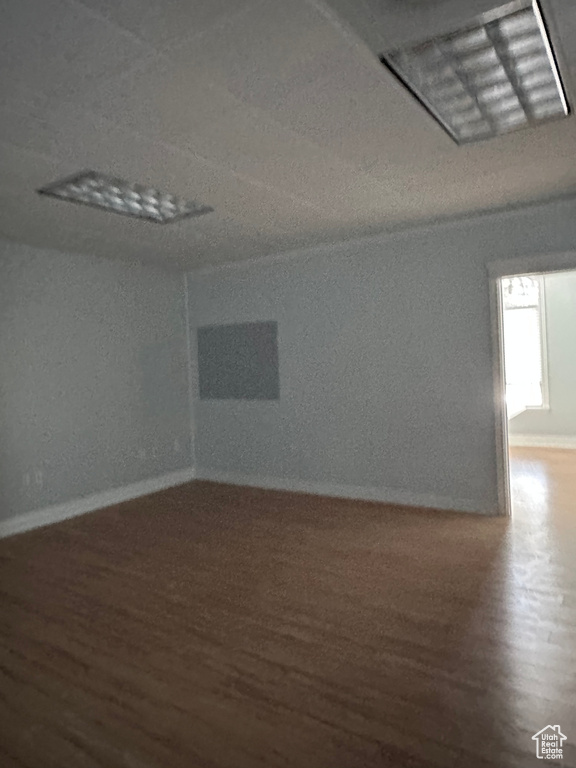 Empty room featuring hardwood / wood-style flooring