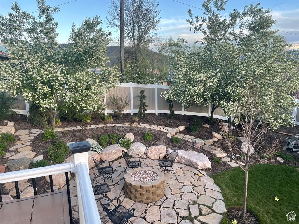 View of patio featuring a fire pit