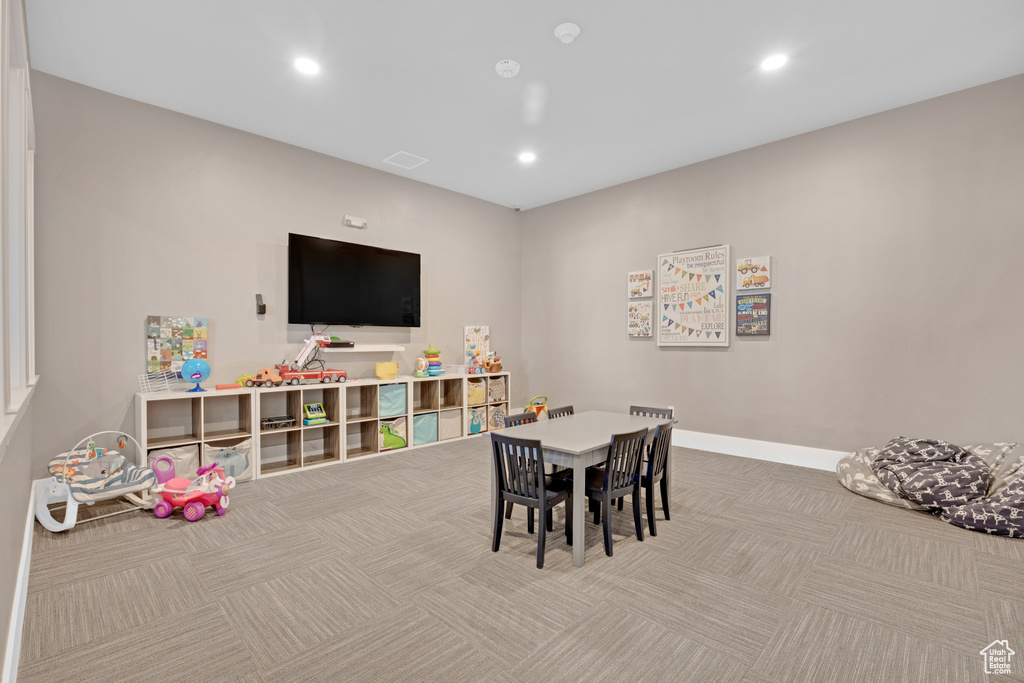 Rec room featuring light colored carpet
