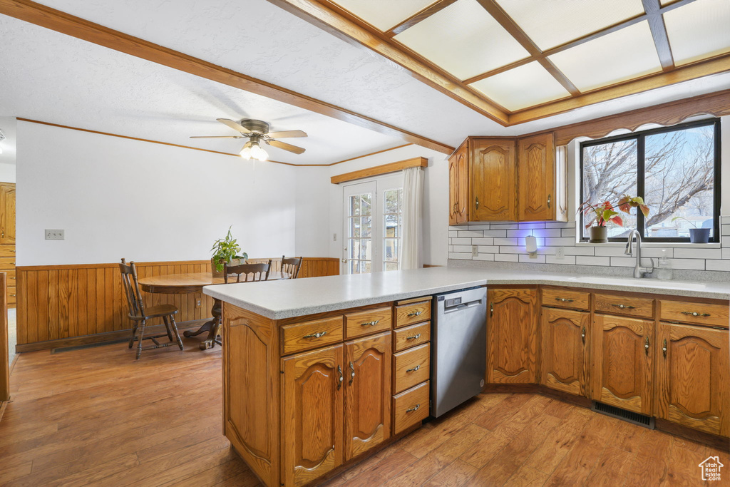 Kitchen with french doors, ceiling fan, tasteful backsplash, light hardwood / wood-style flooring, and dishwasher