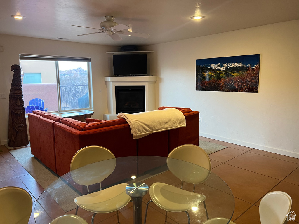 Tiled living room featuring ceiling fan