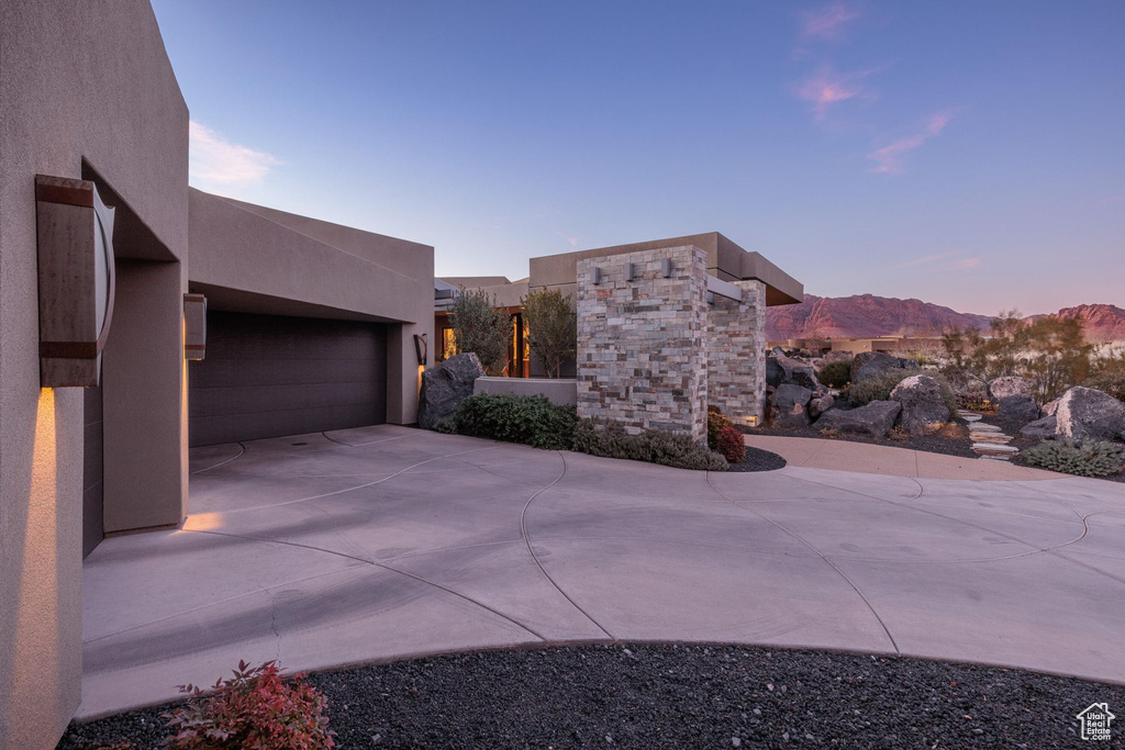 Exterior space featuring a garage and a mountain view