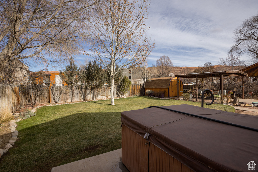 View of yard with a hot tub