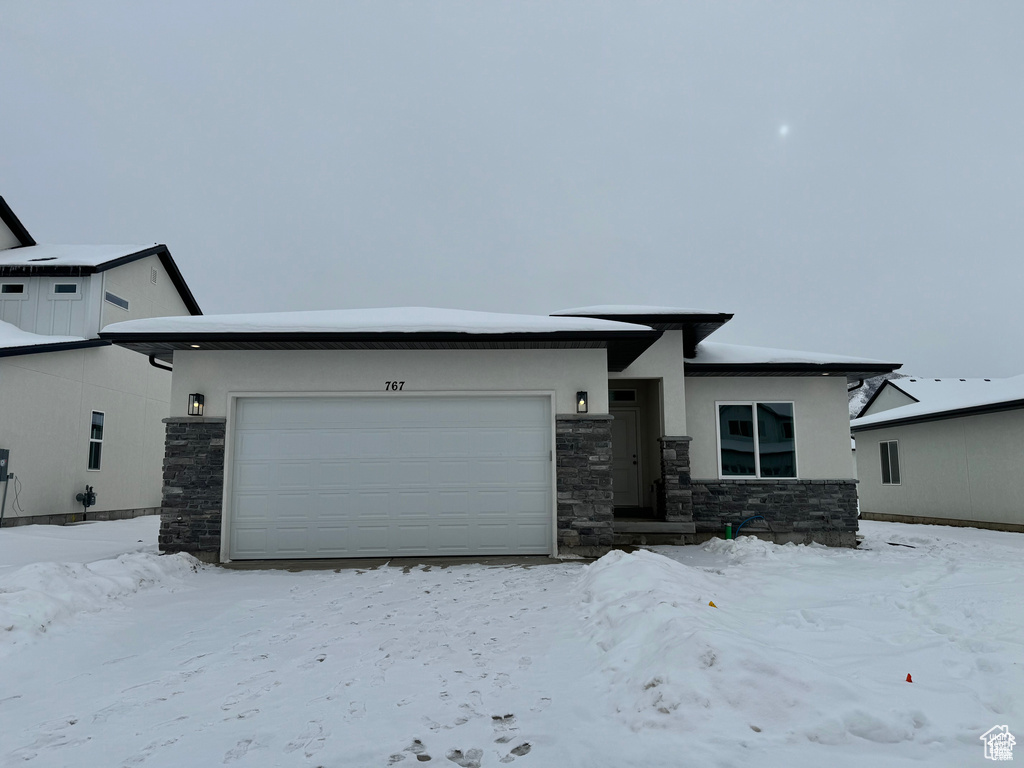 View of front of property with a garage