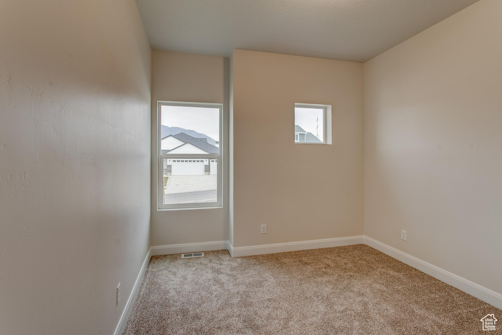 View of carpeted spare room