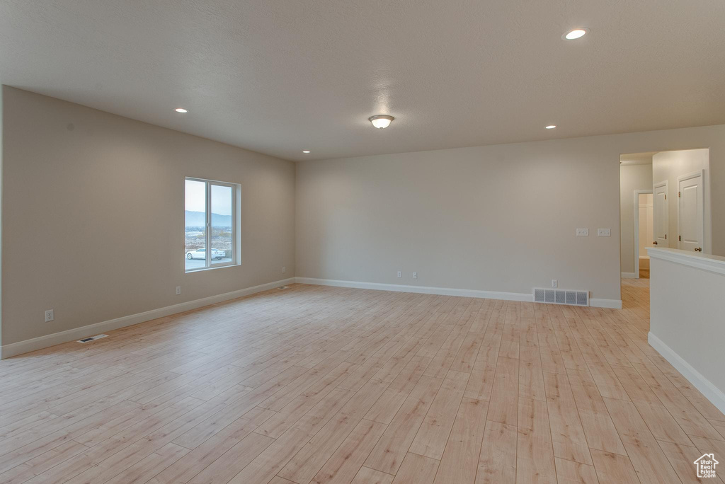 Spare room featuring light hardwood / wood-style floors