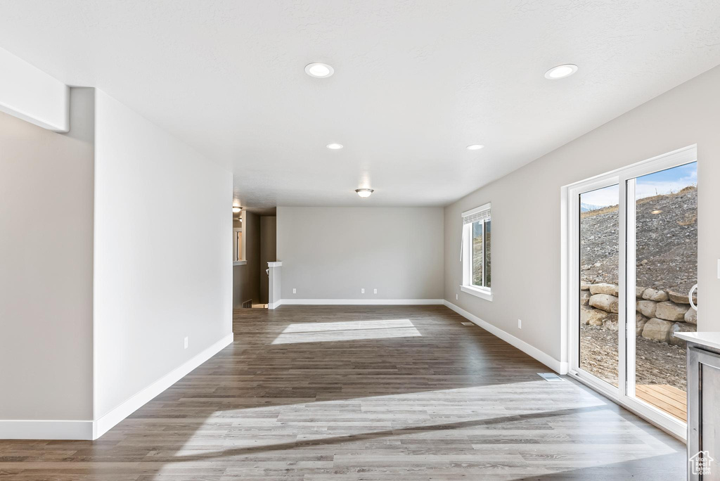 Unfurnished room with dark hardwood / wood-style floors