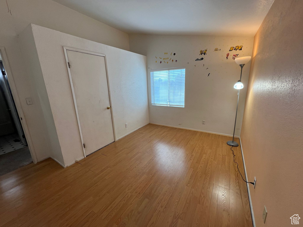 Unfurnished bedroom with light hardwood / wood-style flooring