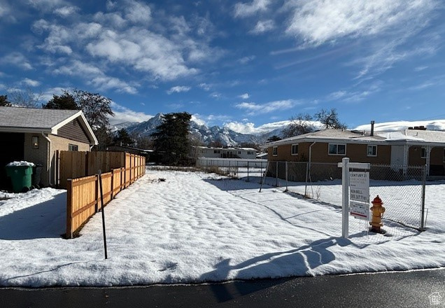 View of snow covered exterior with a mountain view