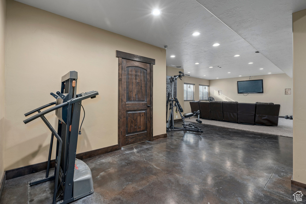 Workout area with a textured ceiling