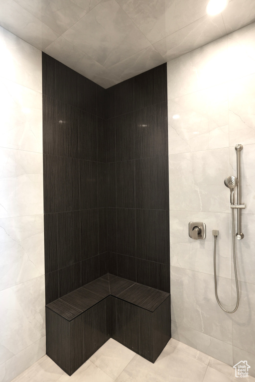 Full bath with a tile shower