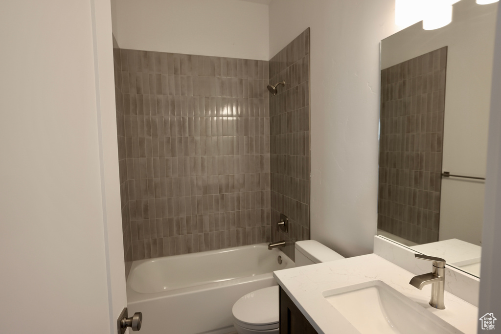 Bathroom with vanity and shower / washtub combination