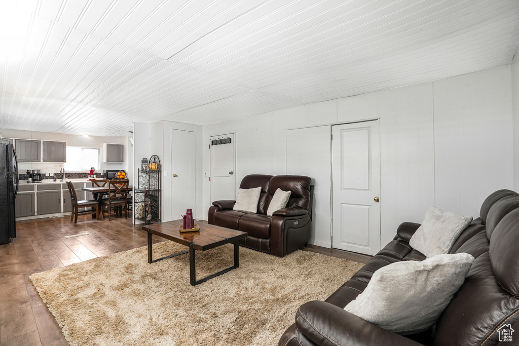 Living room with hardwood / wood-style flooring