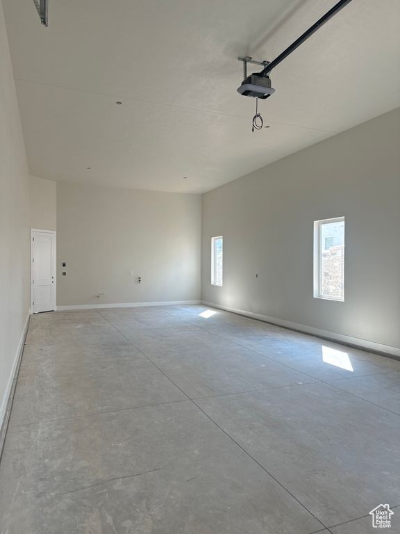 Garage featuring a garage door opener