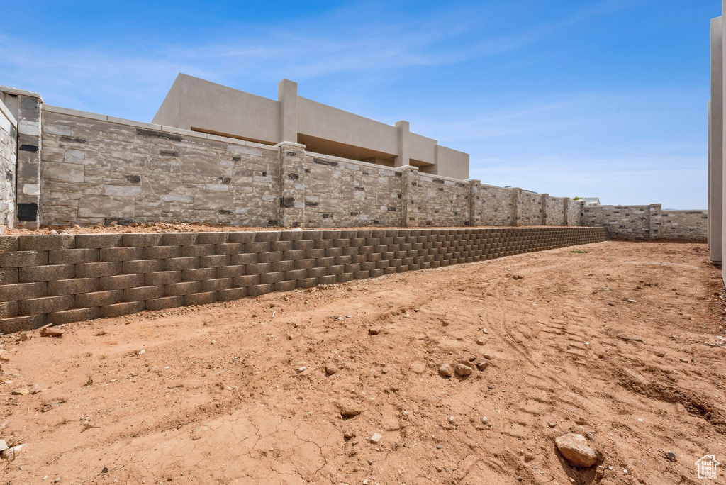 View of yard featuring fence
