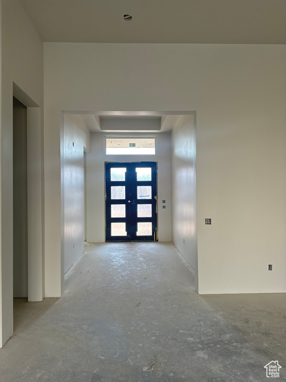 Empty room featuring french doors