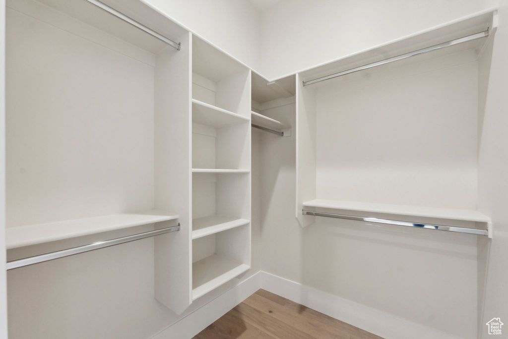 Walk in closet featuring light wood-type flooring