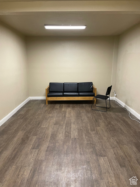 Sitting room with dark hardwood / wood-style floors