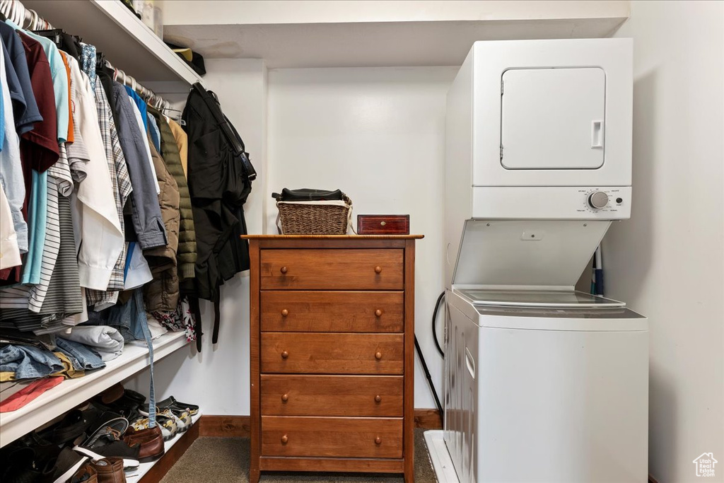 Clothes washing area with stacked washer and clothes dryer