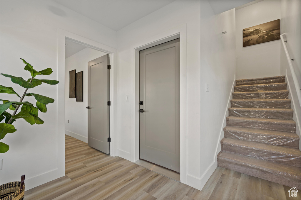Corridor with light wood-type flooring