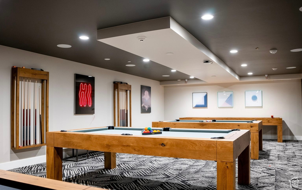 Rec room with pool table and dark colored carpet