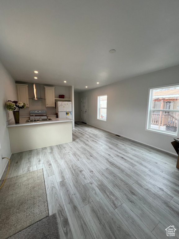 Unfurnished living room featuring light hardwood / wood-style flooring