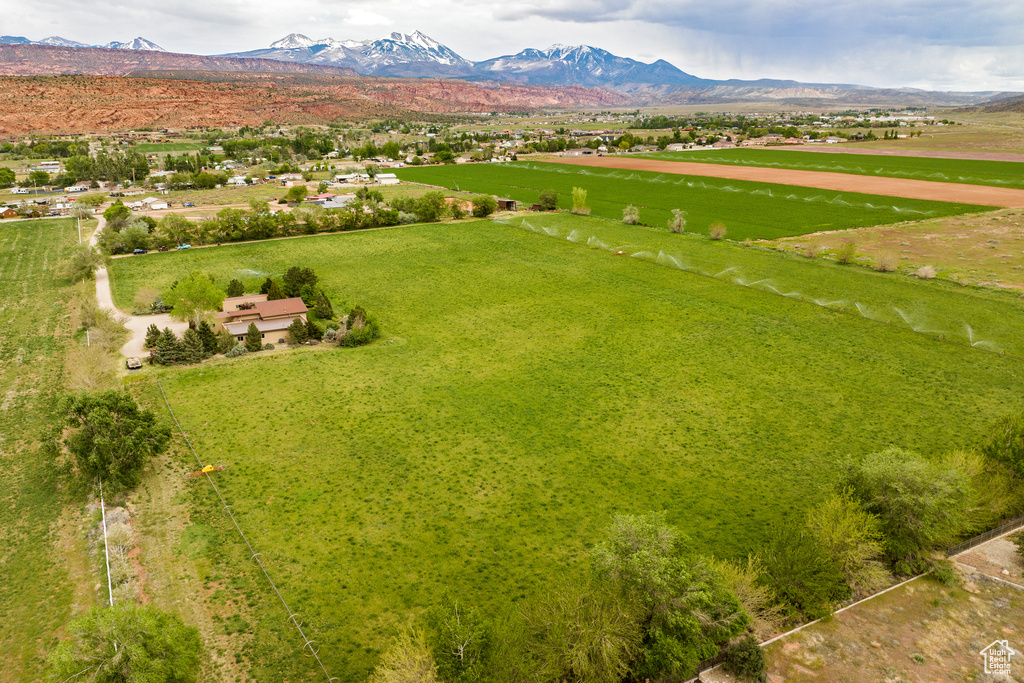 Birds eye view of property with a rural view and a mountain view