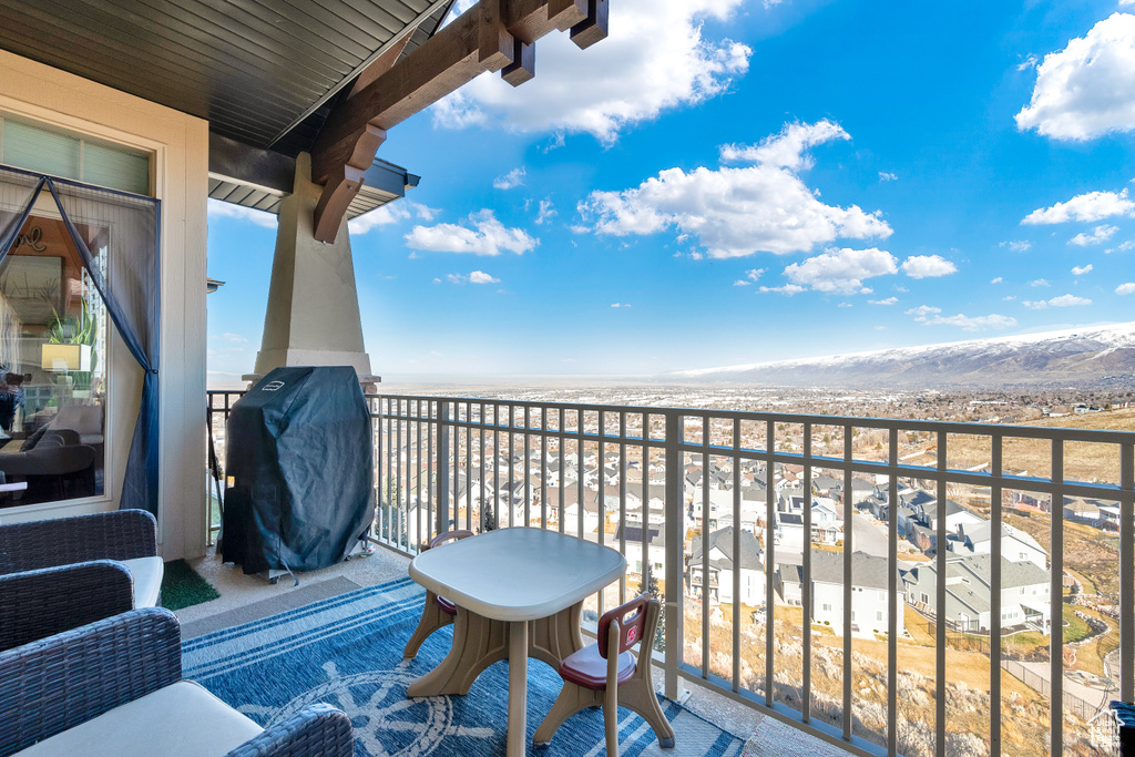 Balcony featuring a mountain view and a grill
