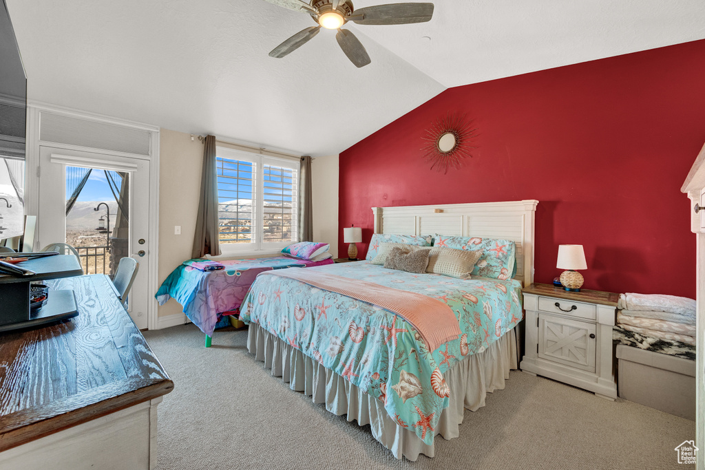 Bedroom featuring ceiling fan, light colored carpet, vaulted ceiling, and access to exterior