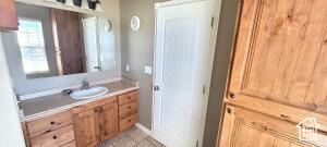 Bathroom with vanity and tile flooring