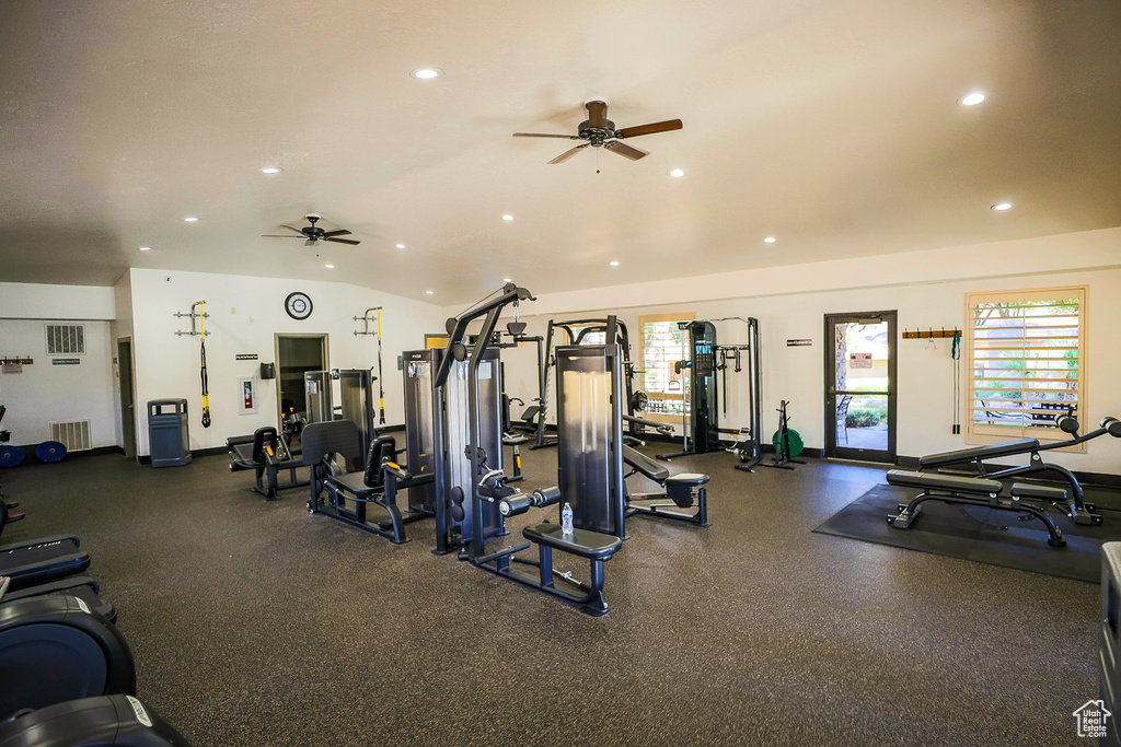 Exercise room with lofted ceiling and ceiling fan