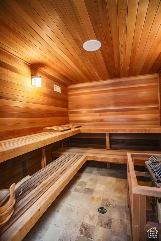 View of sauna / steam room featuring tile flooring and wood ceiling